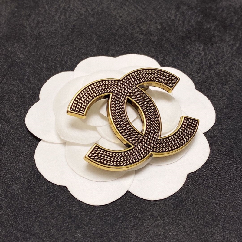 Ch**el brooches